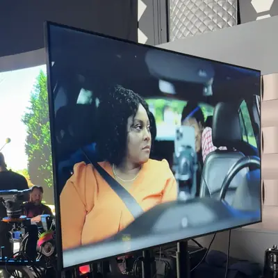 Looping clip: an actor's take plays back on the monitor at video village on a commercial set