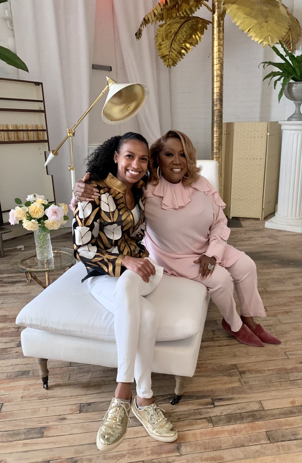 Chelsea seated with Patti LaBelle on set